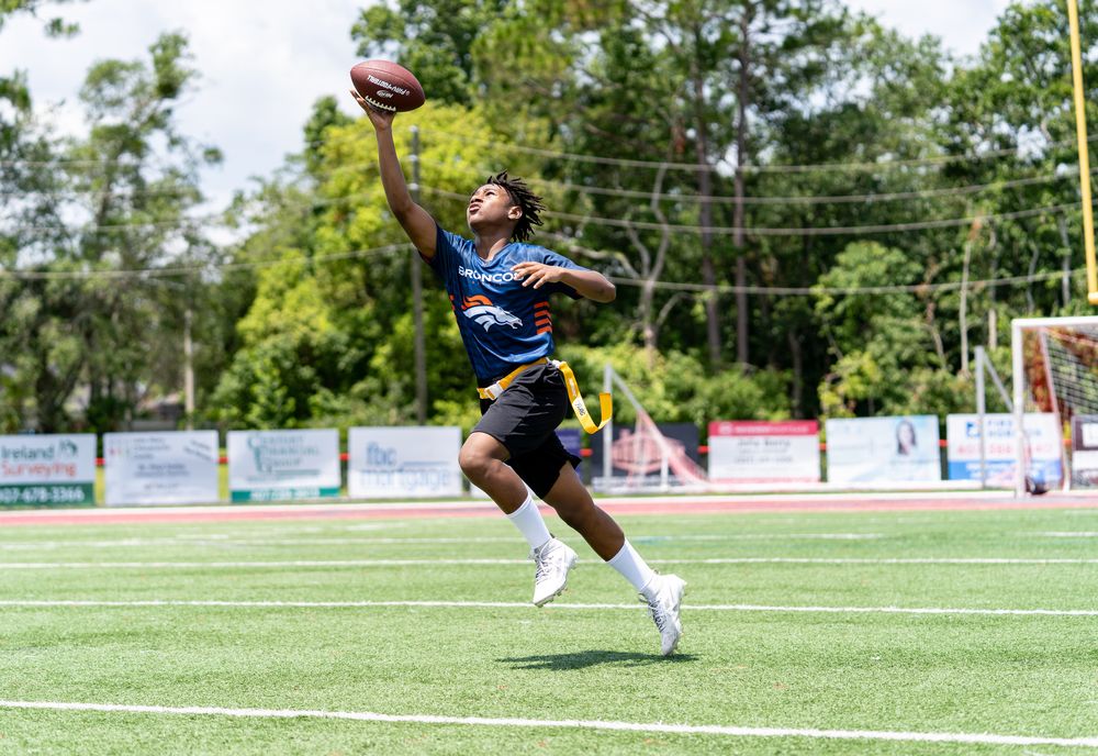 Flag football player making a one-handed catch