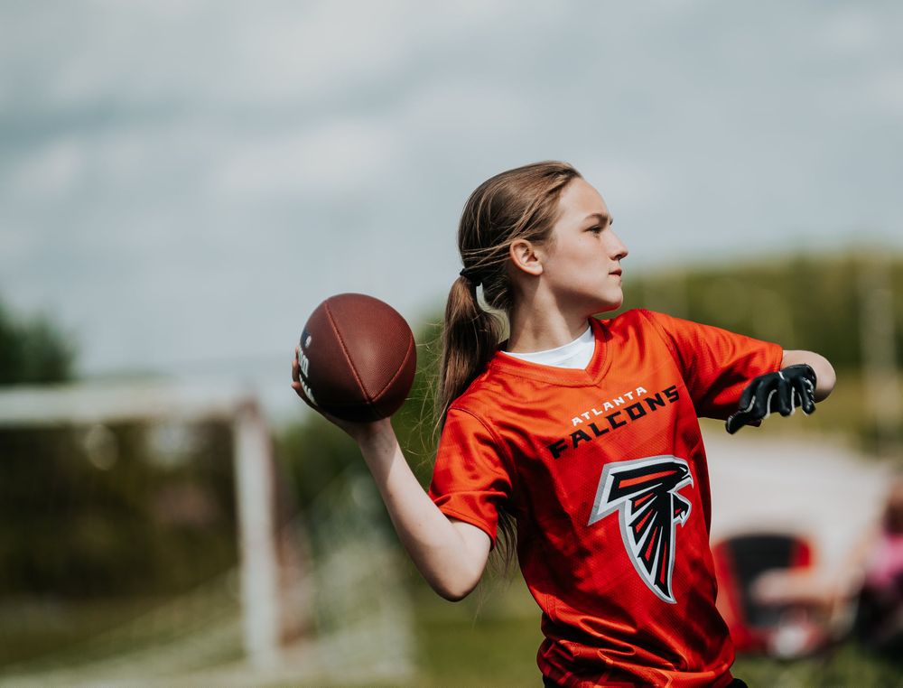 Flag football quarterback throwing a pass